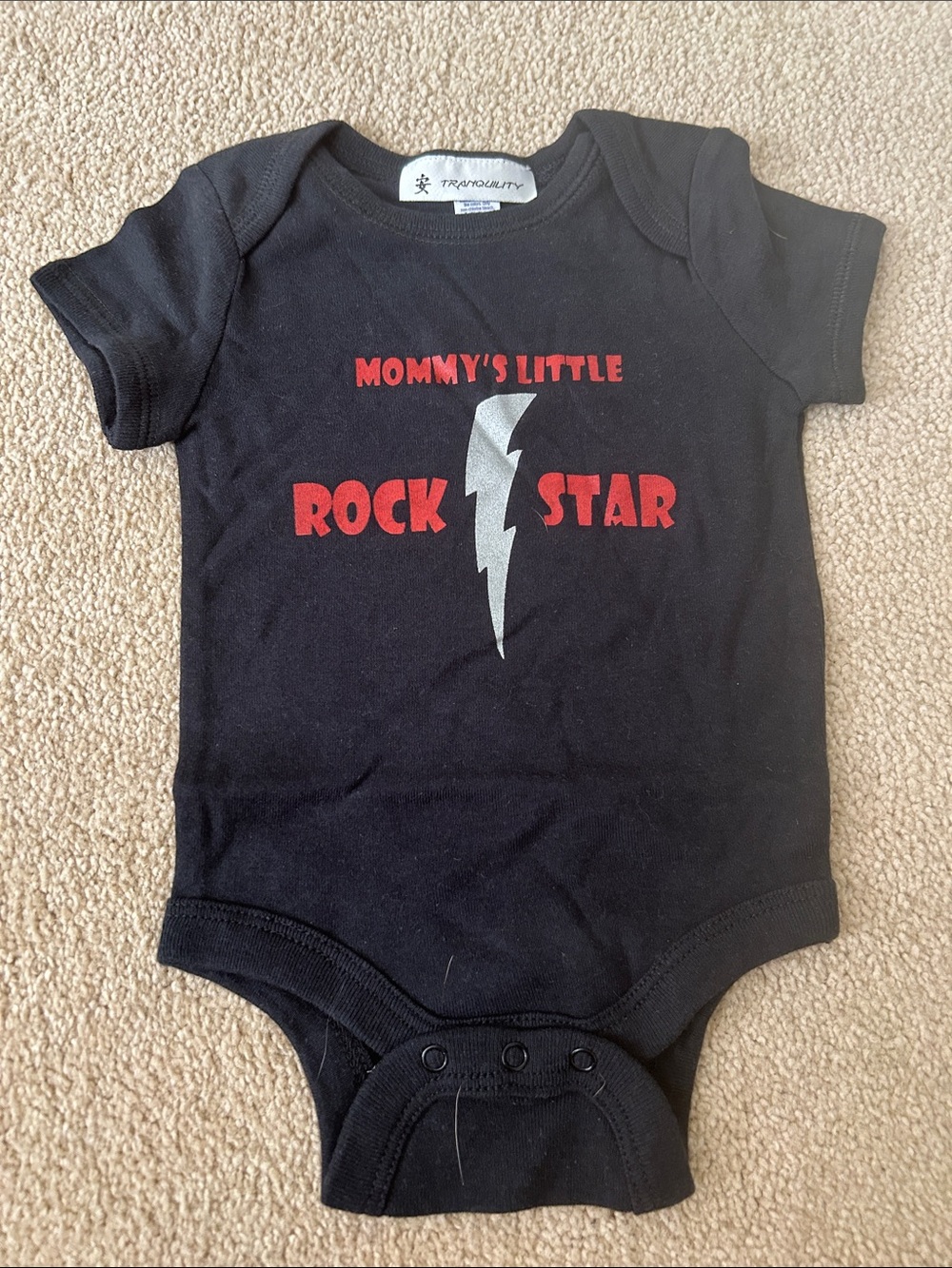 Tranquility Clothing Black One-Piece with Red Text and Silver Bolt